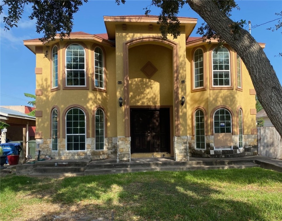 a front view of a house with a yard