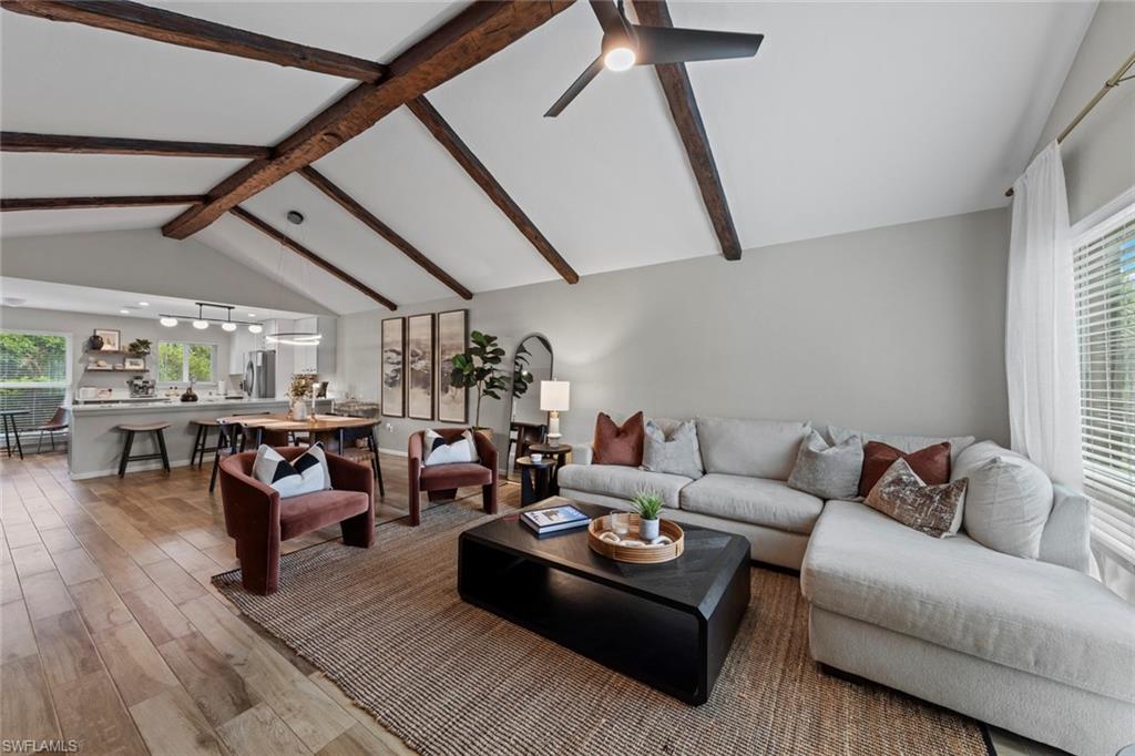 a living room with furniture and white walls