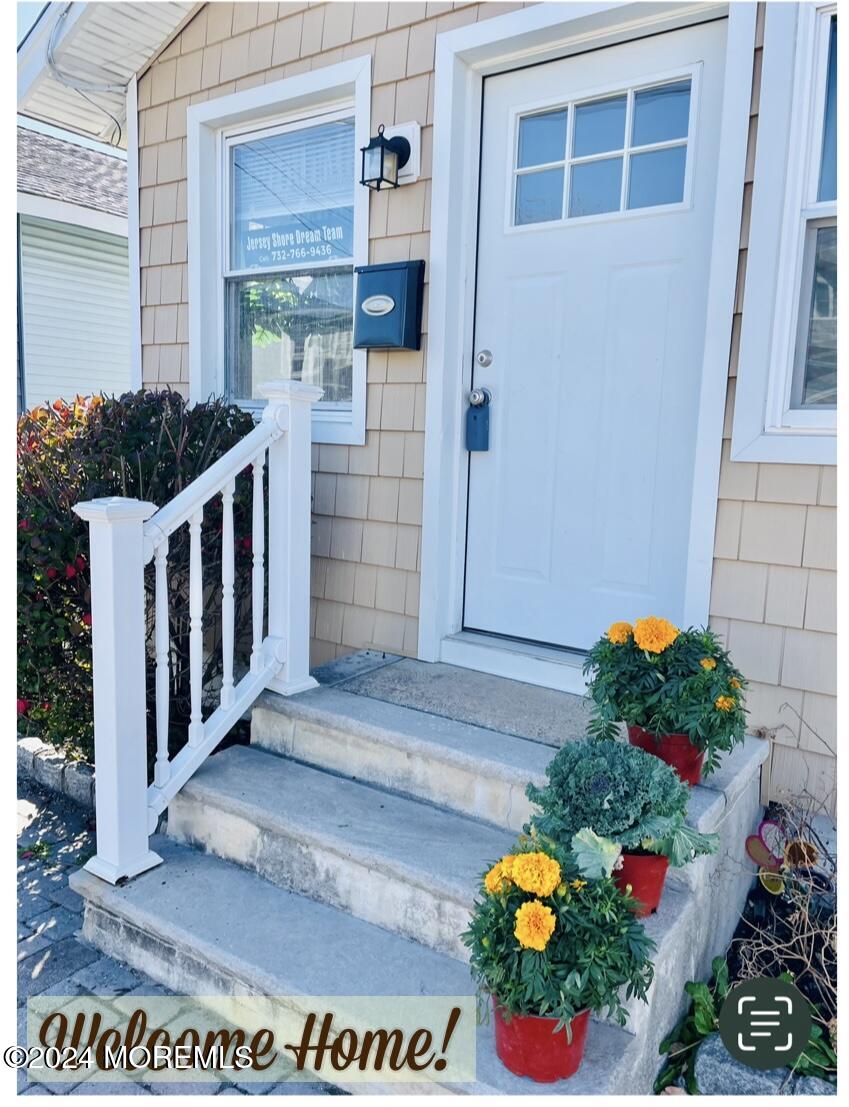 a view of entryway with flower pots