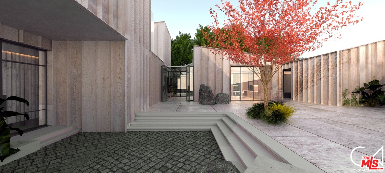 a view of a pathway with a potted plants in front of a house