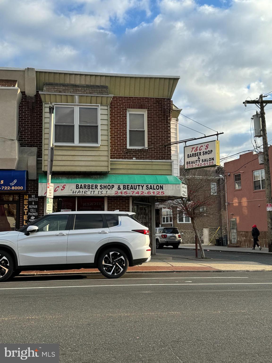 a view of a car parked in front of a building