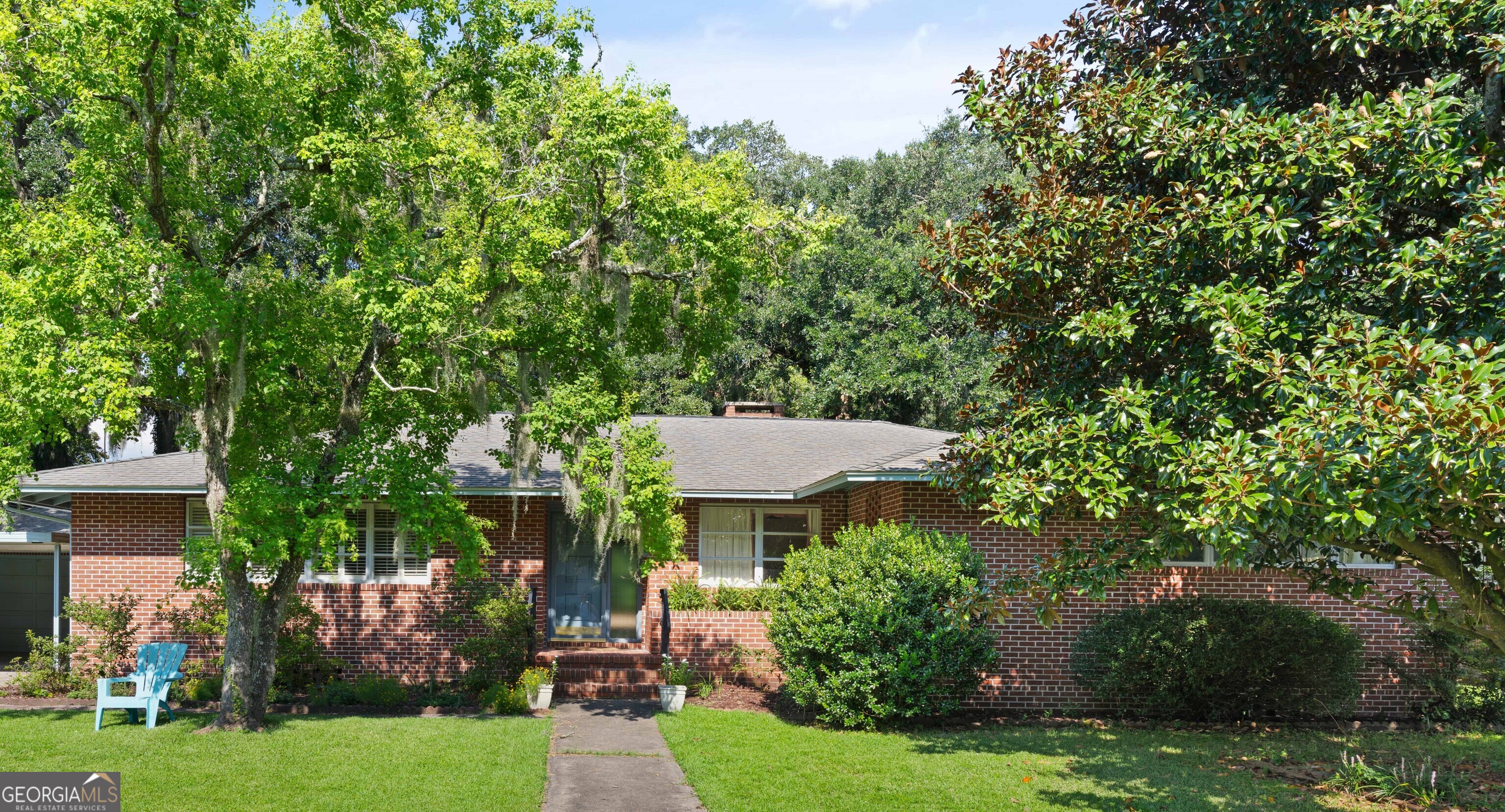 a view of a house with a garden