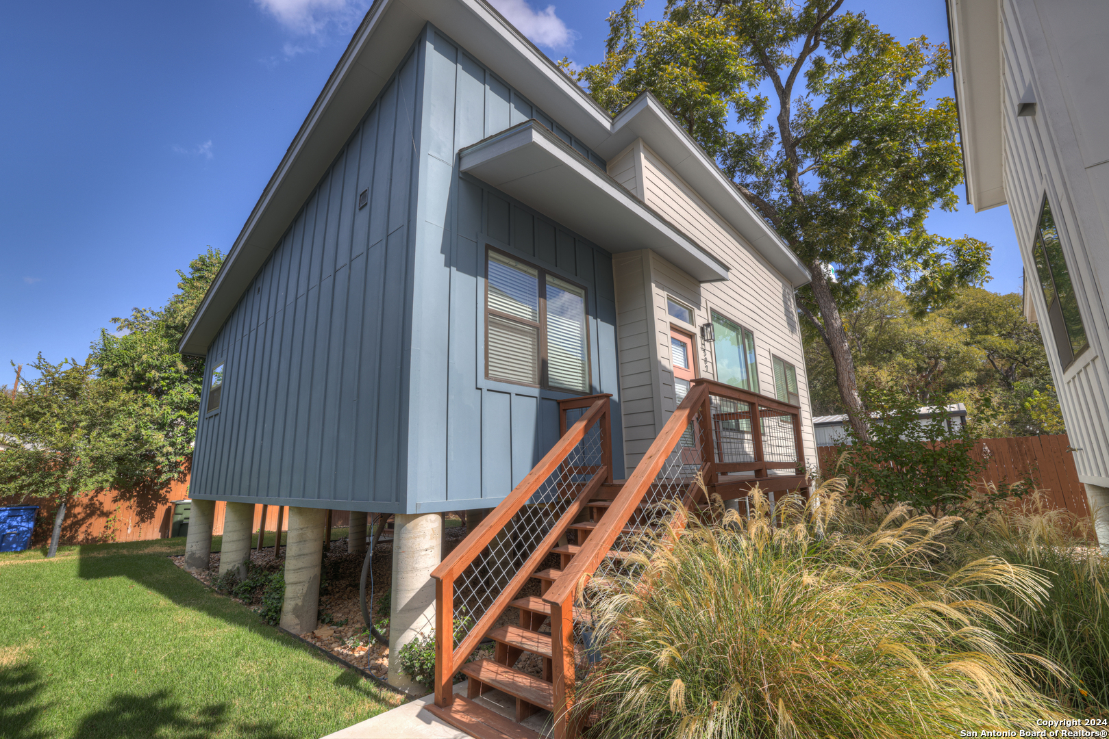 a house view with a backyard space