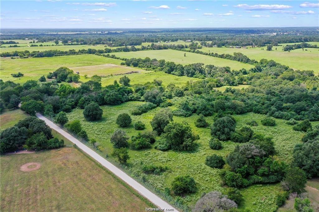 Birds eye view of property with a rural view