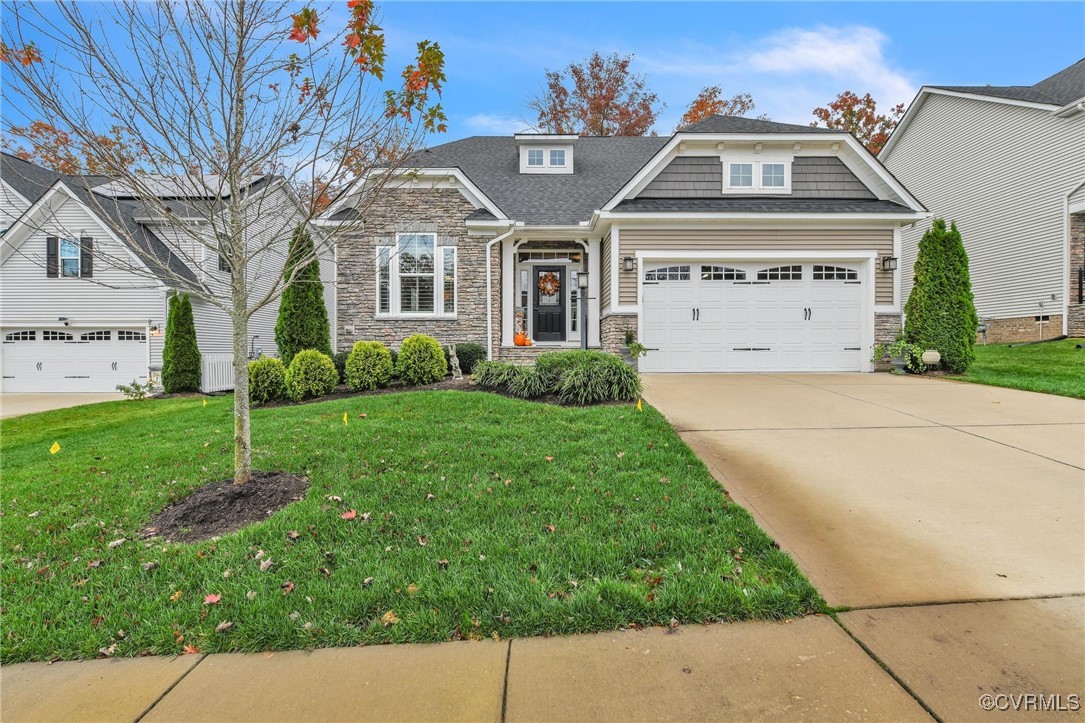 View of front of home featuring a garage and a fro