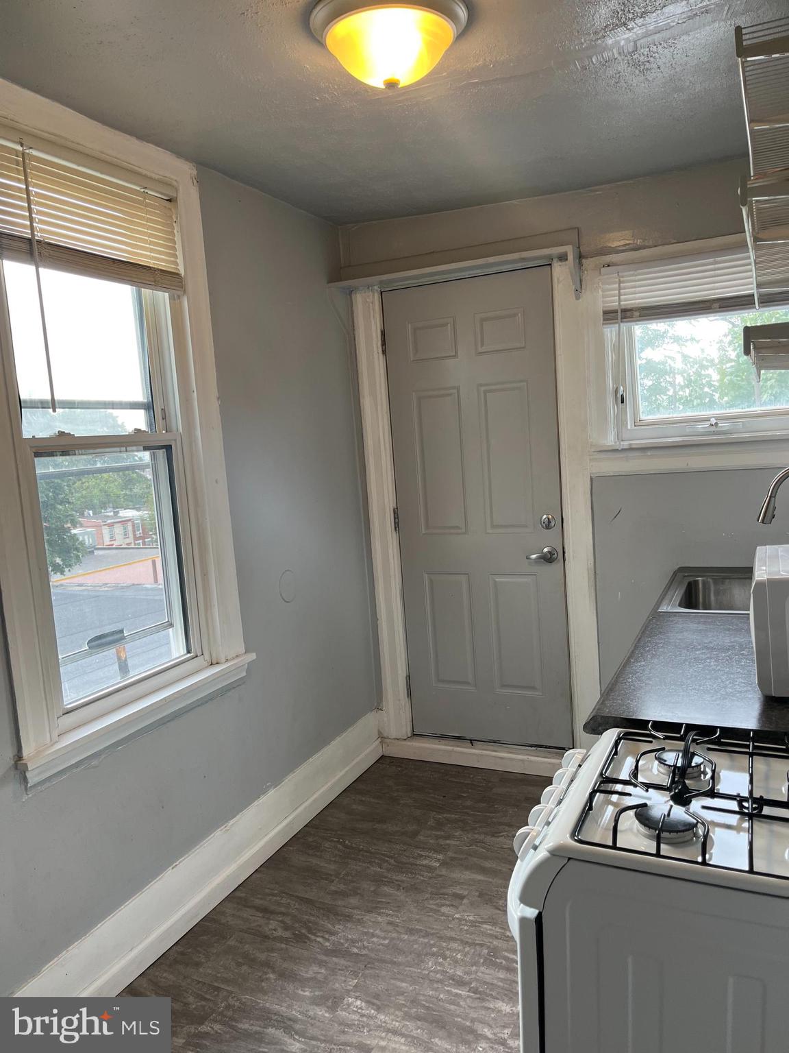 a room with wooden floor and window