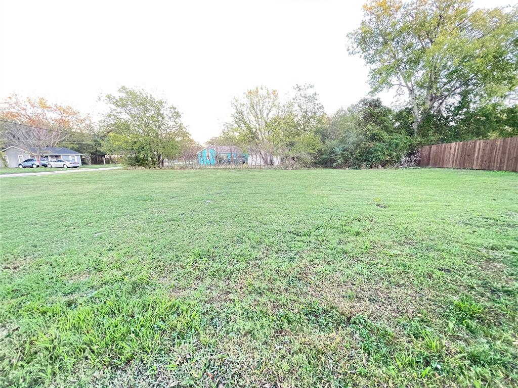 a view of outdoor space with deck and yard