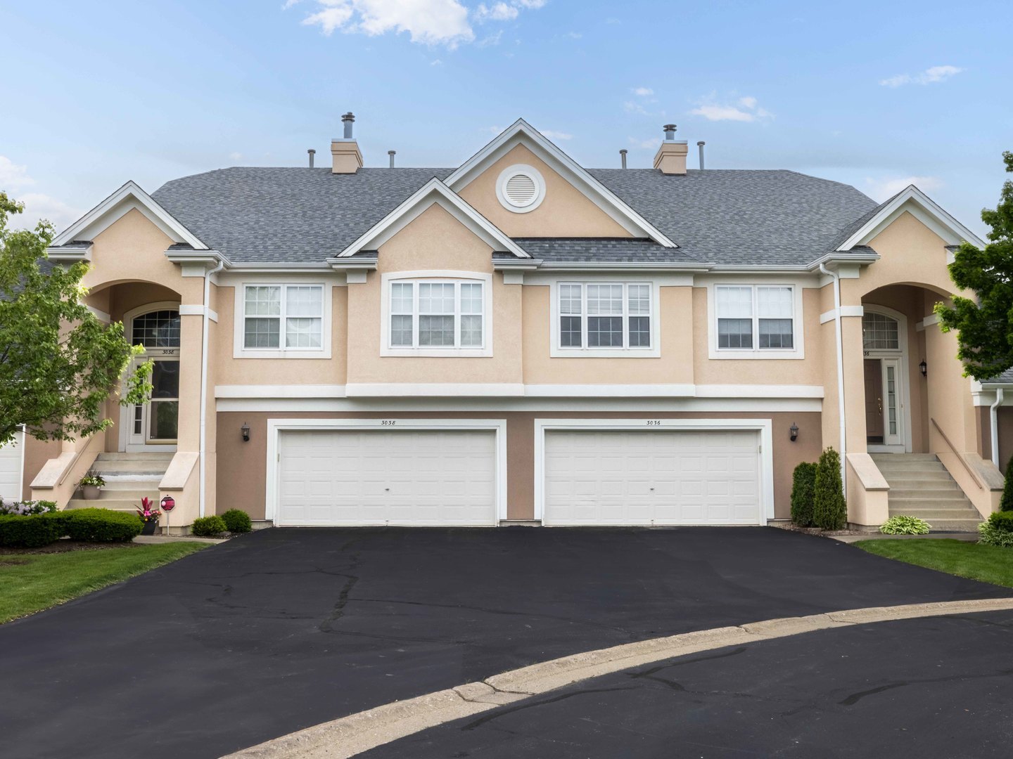 a front view of a house with a yard