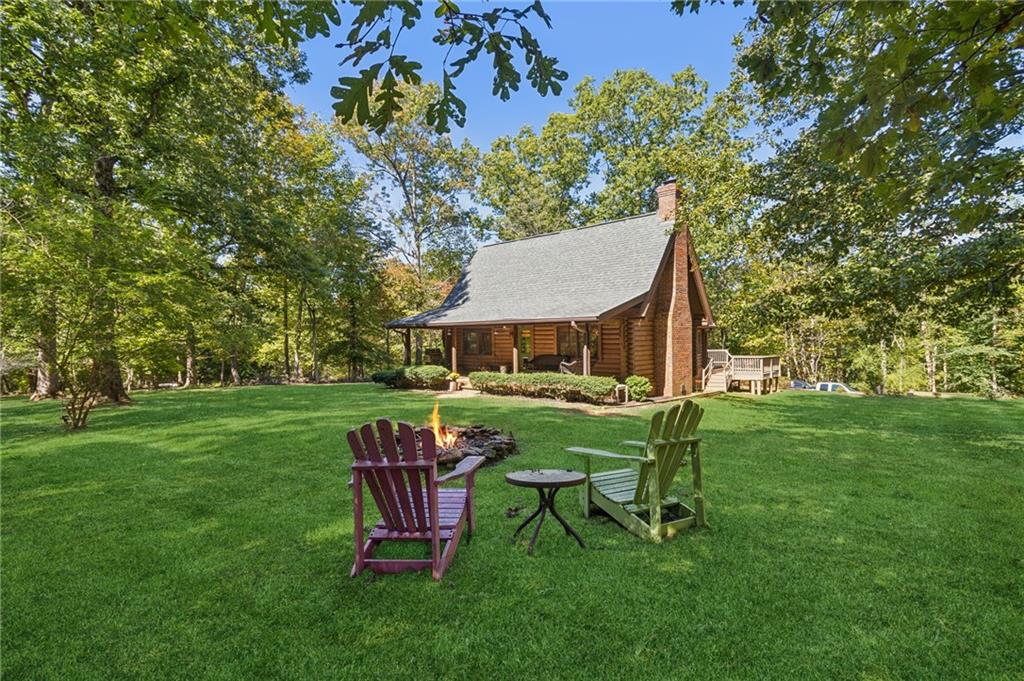 a view of a table and chairs in the garden