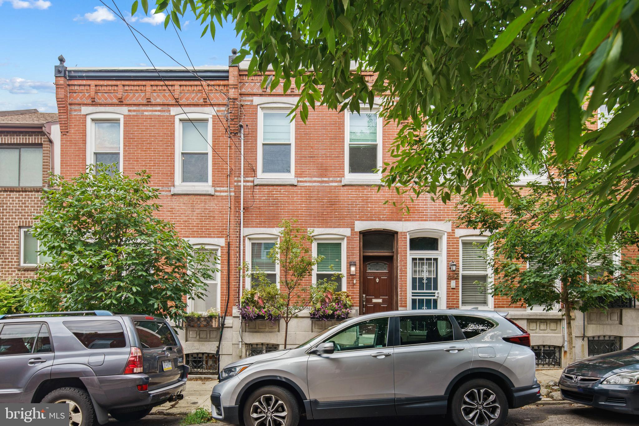 a front view of a house with parking space