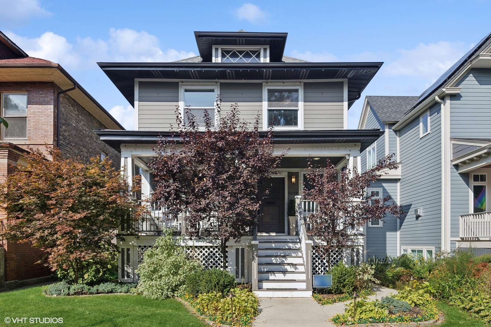 a front view of a house with garden