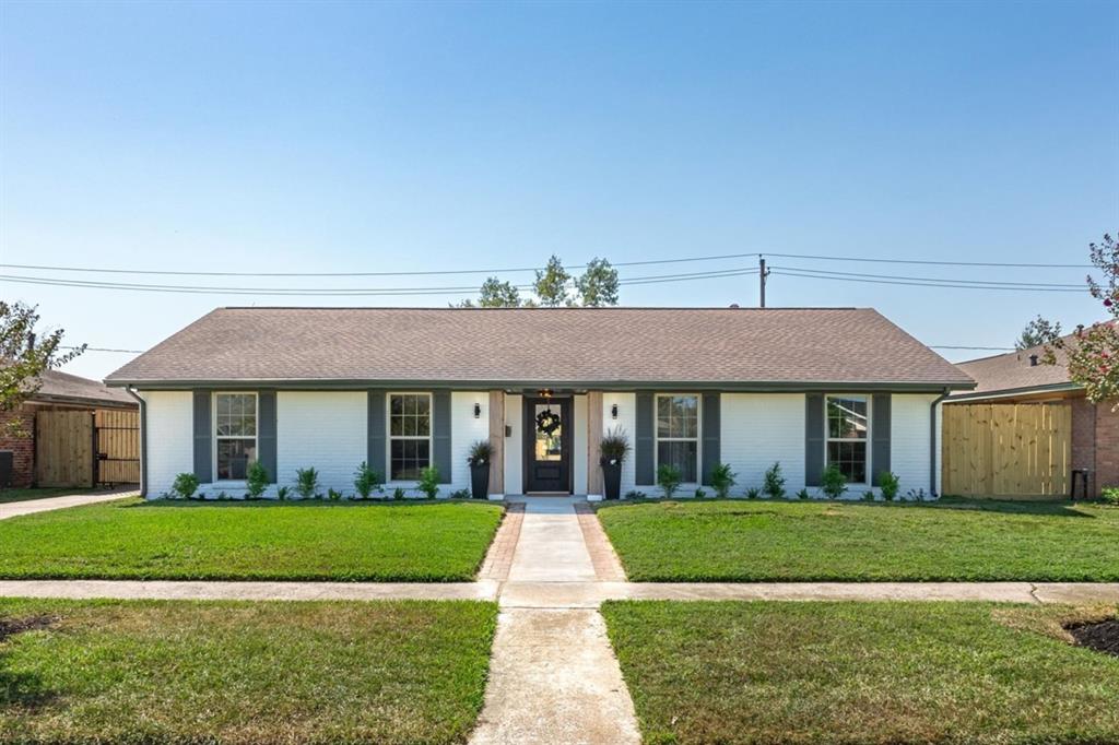 a view of house in front of yard