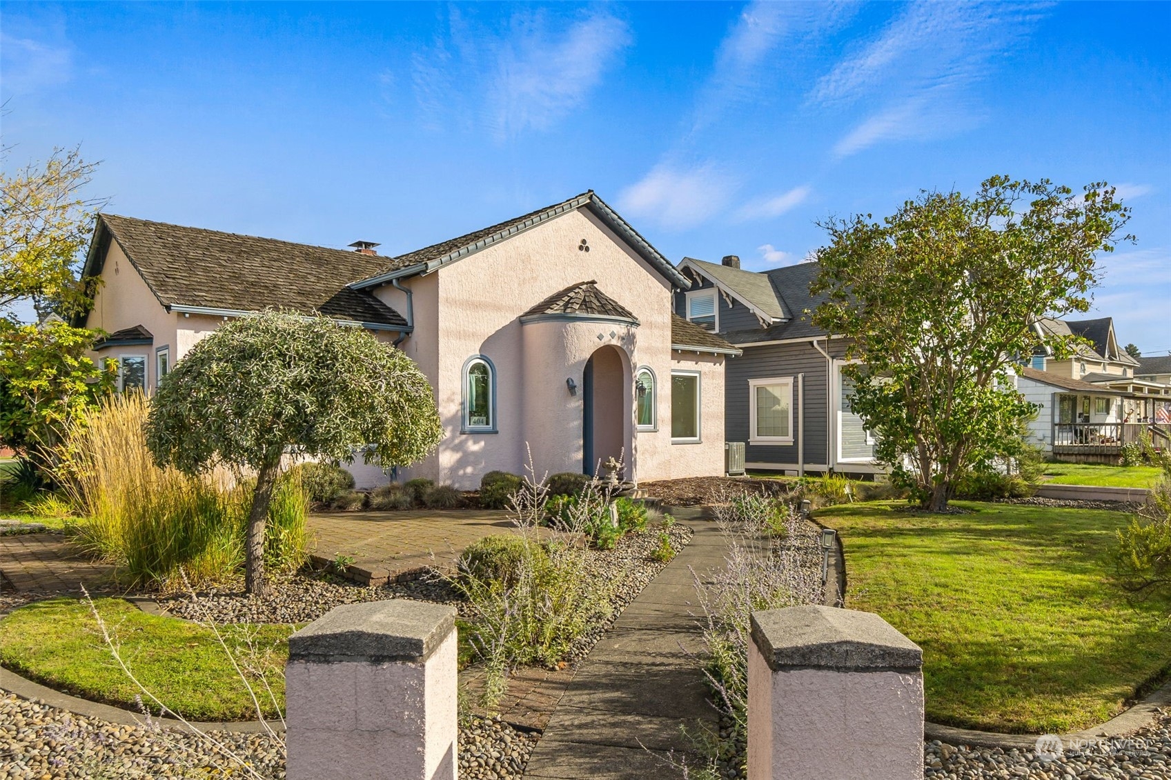 a front view of a house with garden