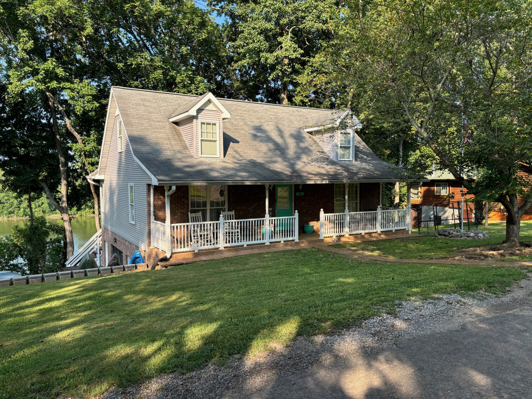 a view of a house with a yard porch and sitting area