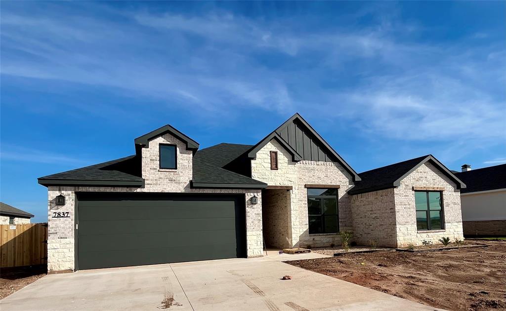 a front view of a house with yard