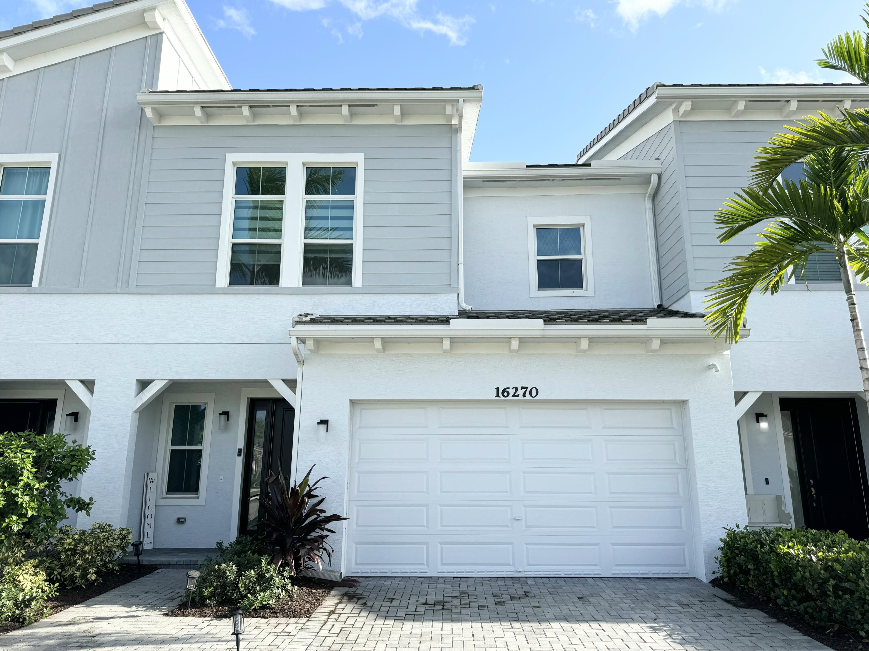 a front view of a house with a garage