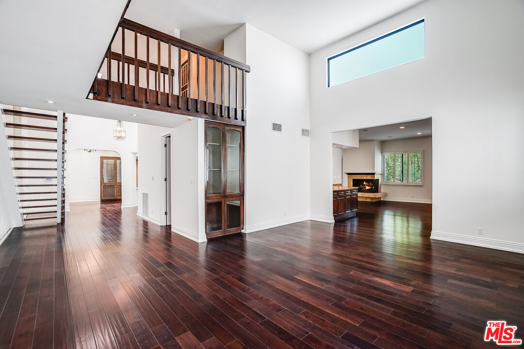 a view of livingroom with hardwood floor and a ceiling fan