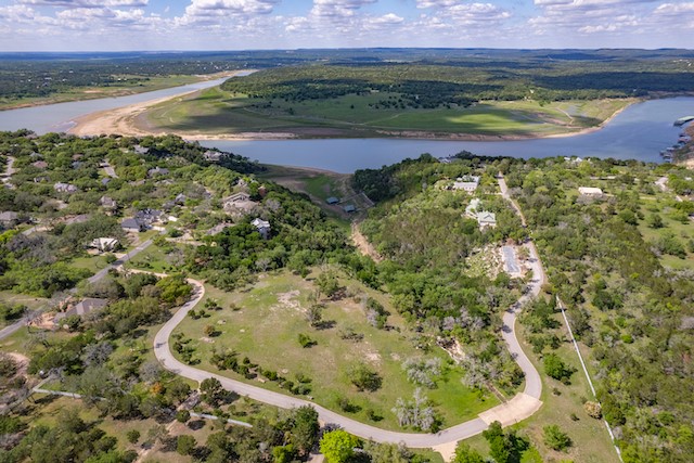 a view of a lake with a yard