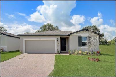 a front view of house with yard and entertaining space