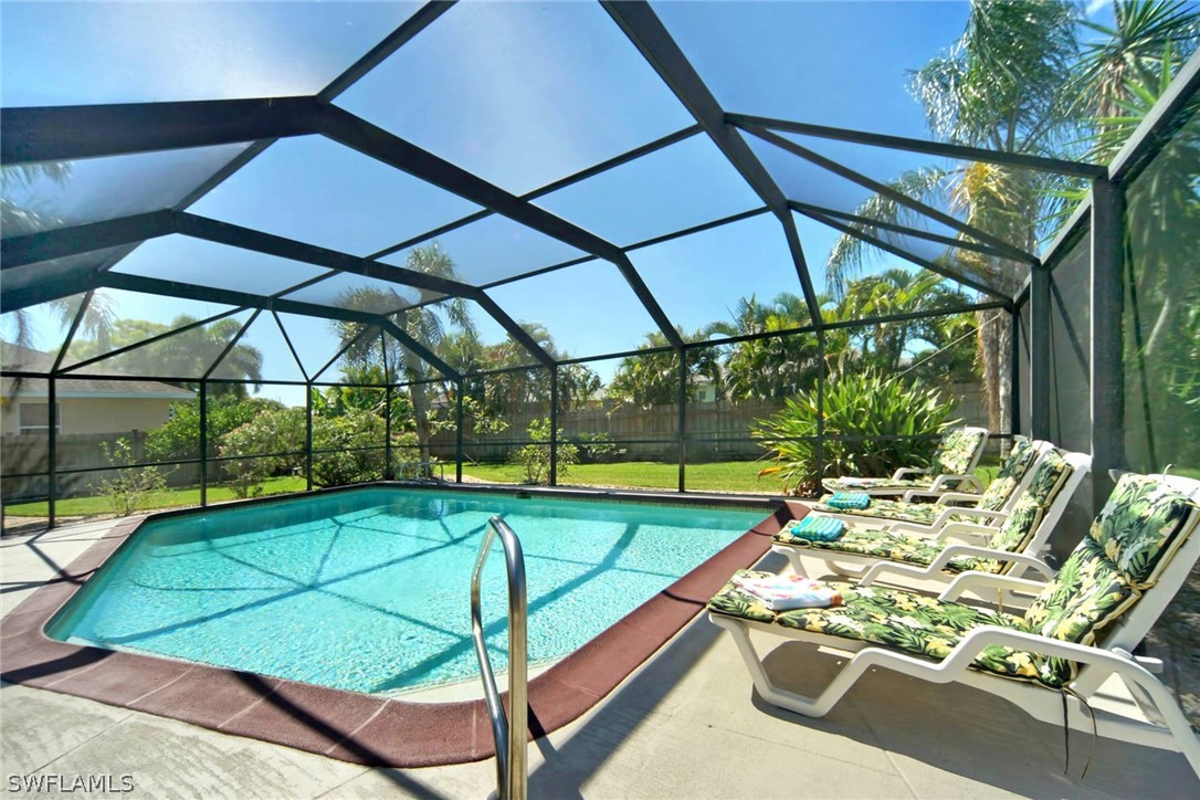 a view of an outdoor sitting area with furniture and umbrella