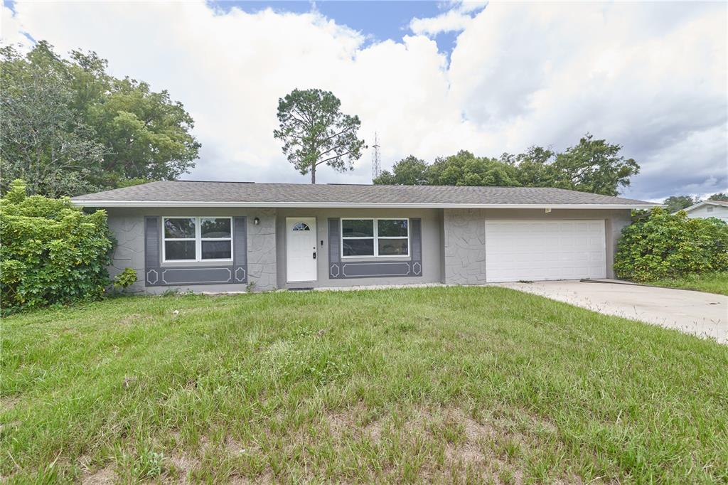 front view of a house with a yard