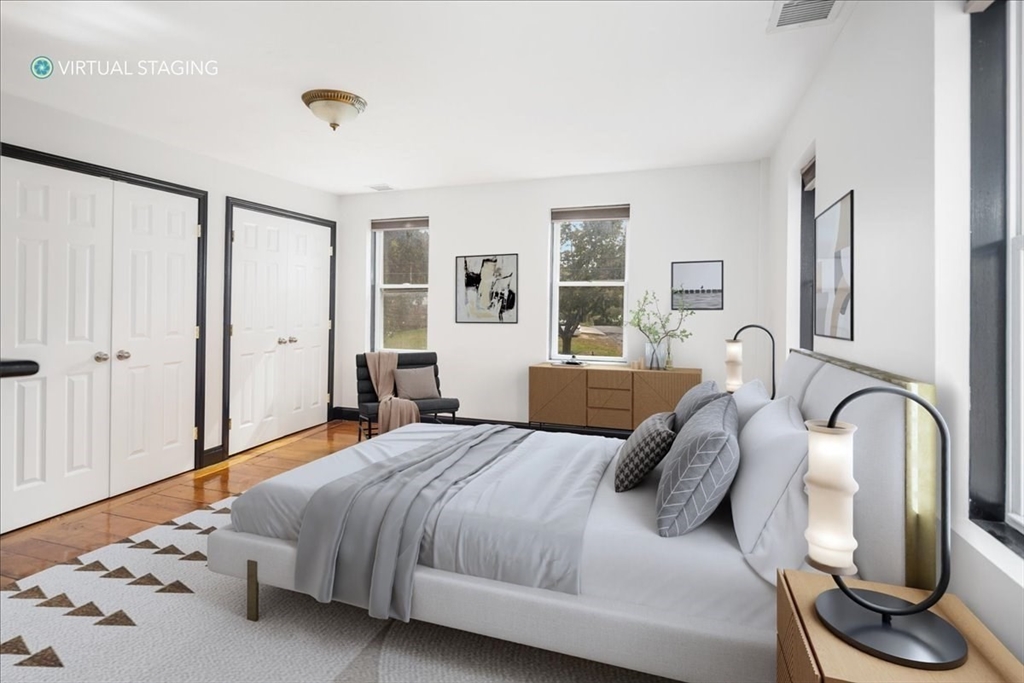 a bedroom with bed and window