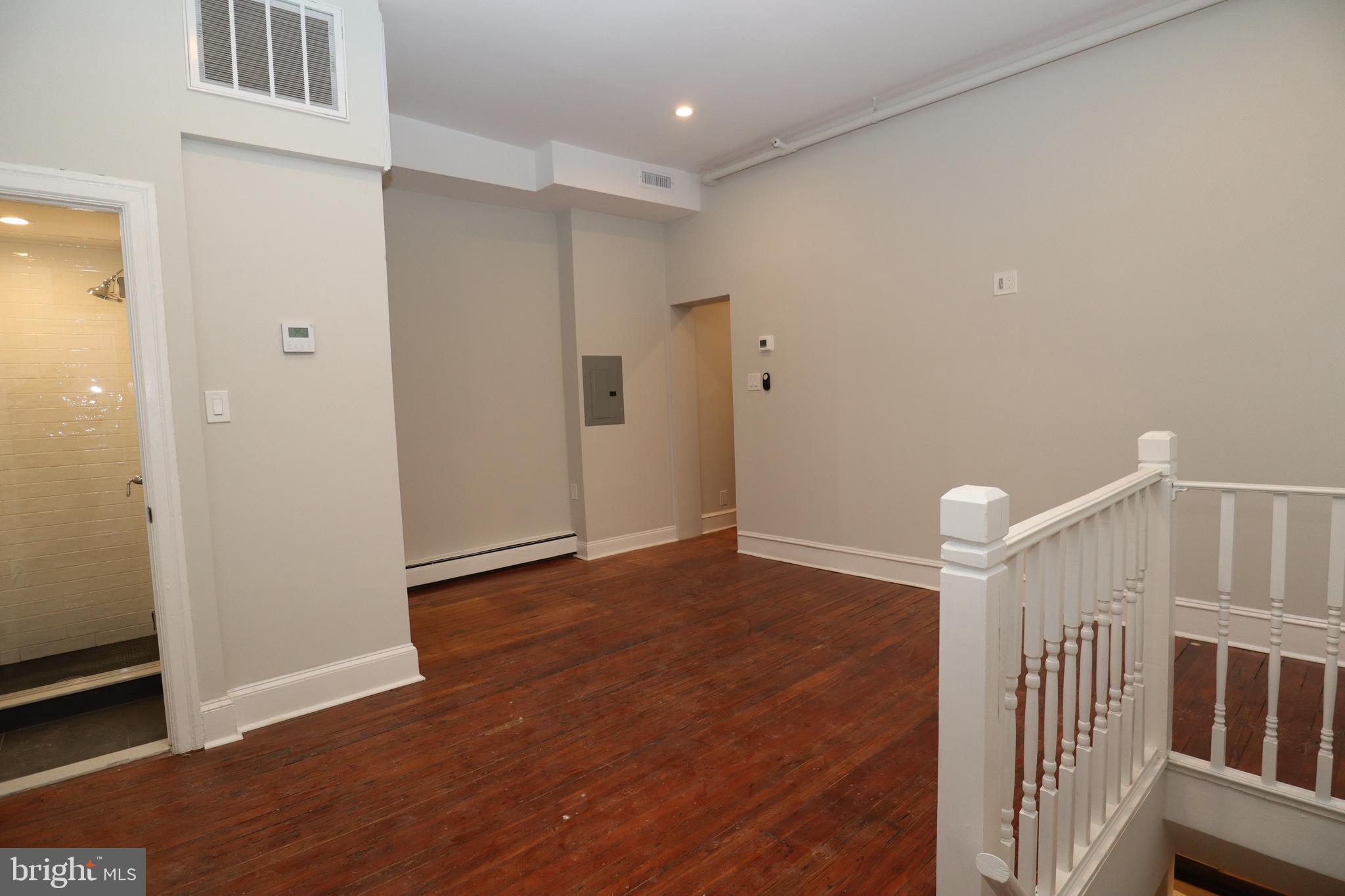 a view of entryway with wooden floor