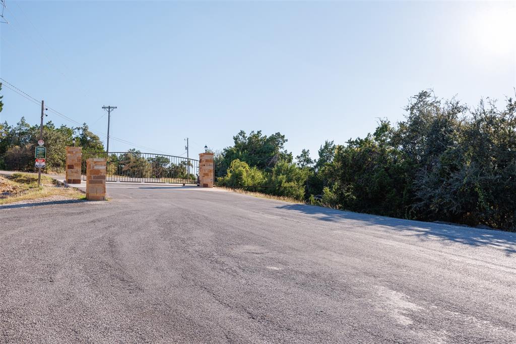 a view of a road with a building in the background