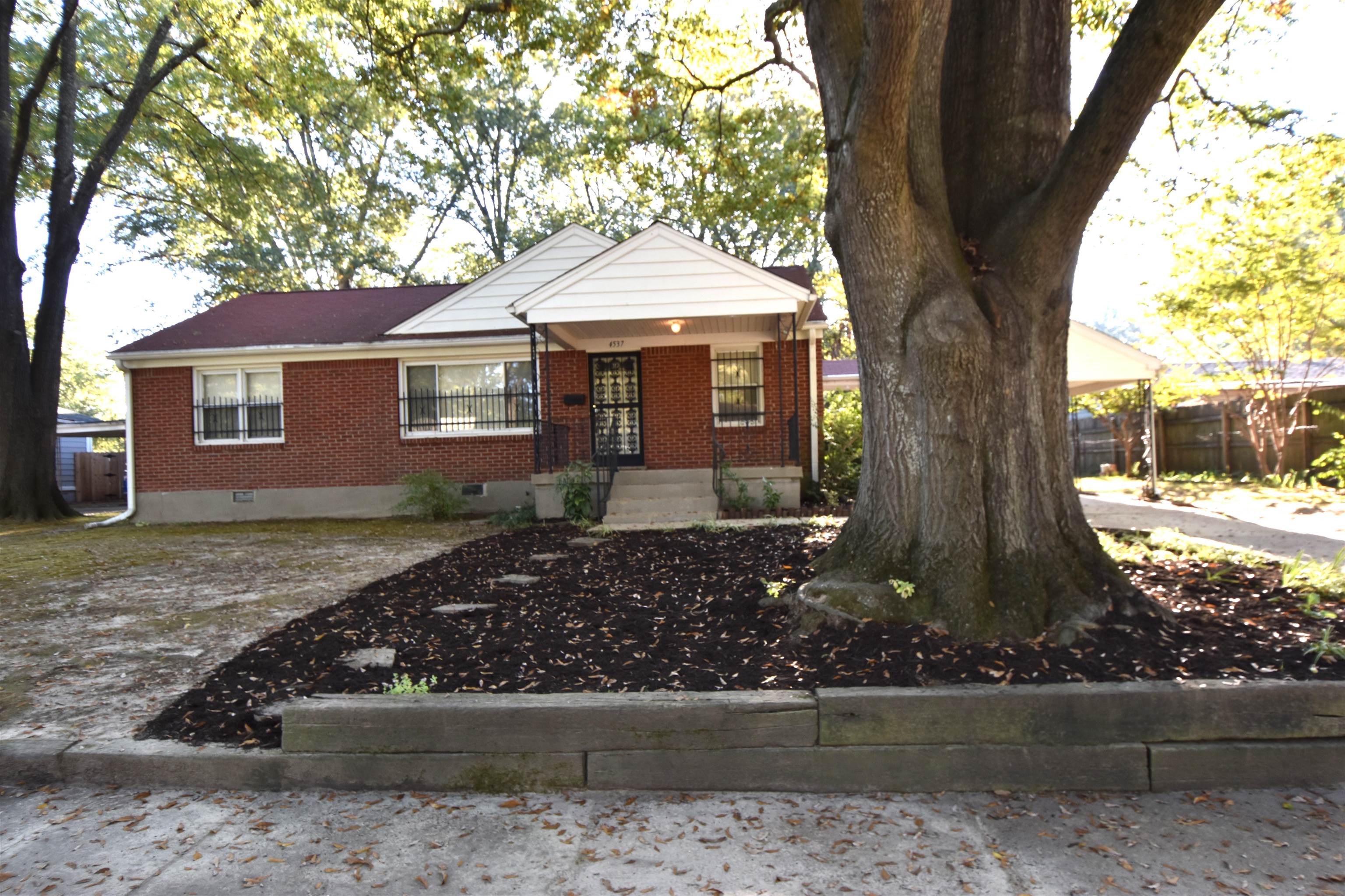 front view of a house with a yard