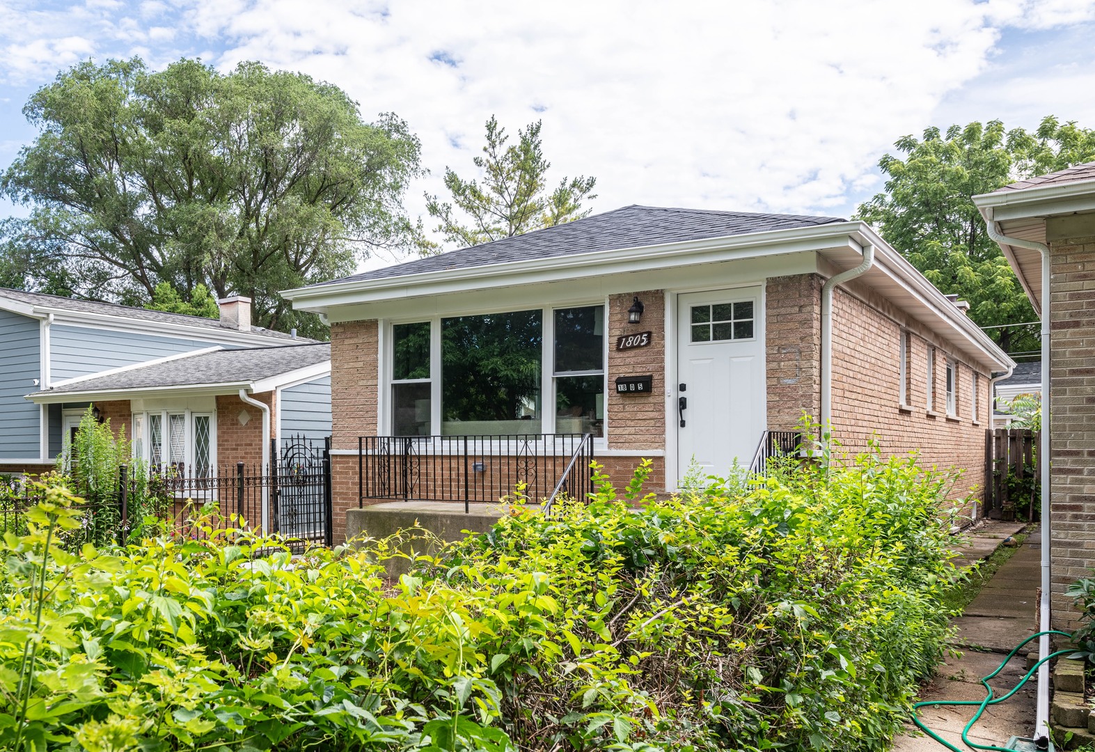 front view of a house with a yard