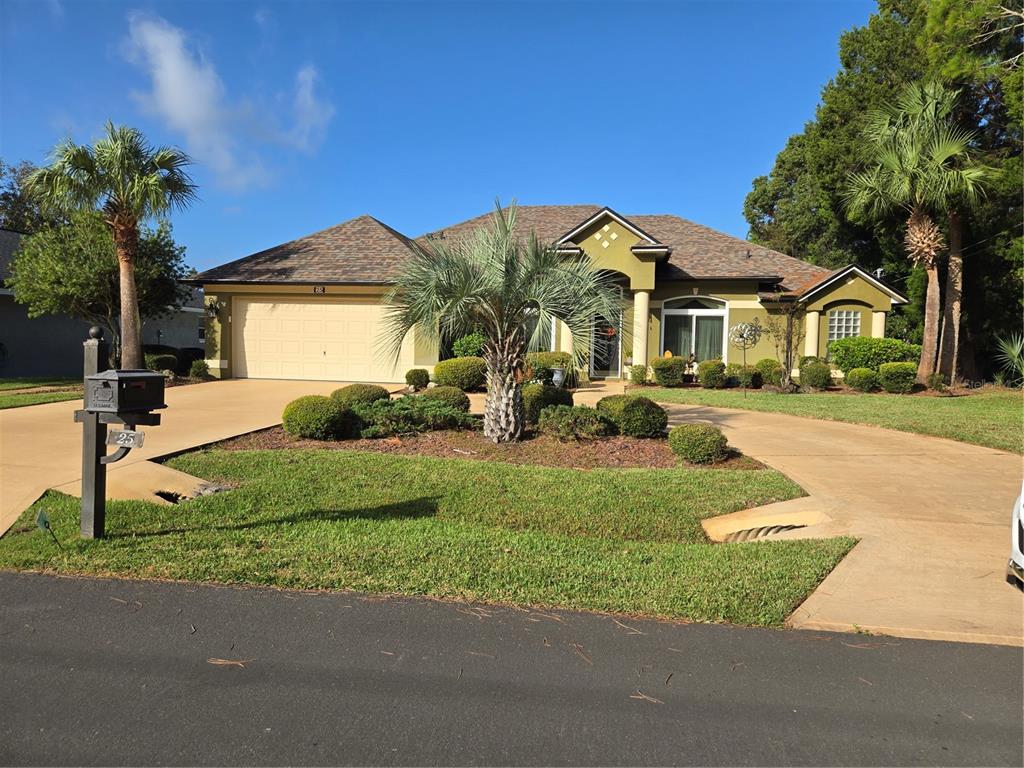 a front view of a house with a yard