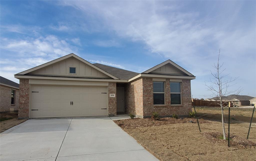 a front view of a house with parking space