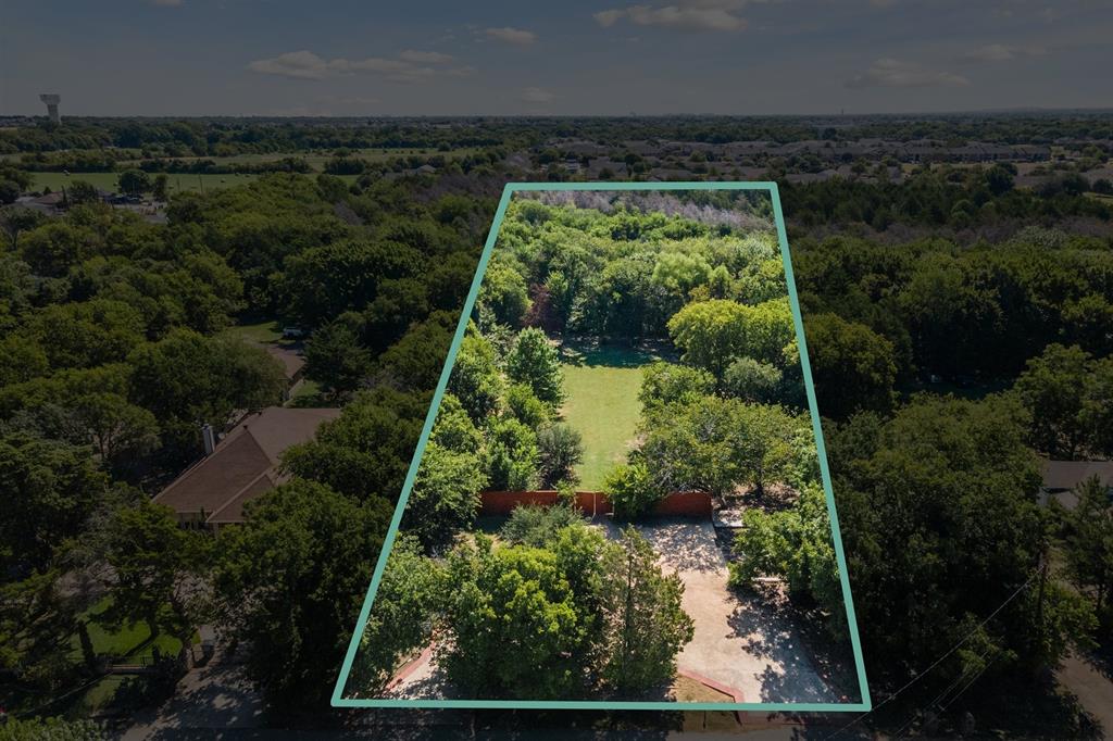 an aerial view of residential house with outdoor space