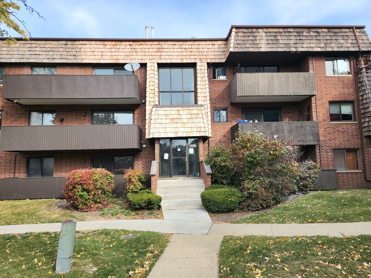 a front view of a house with parking