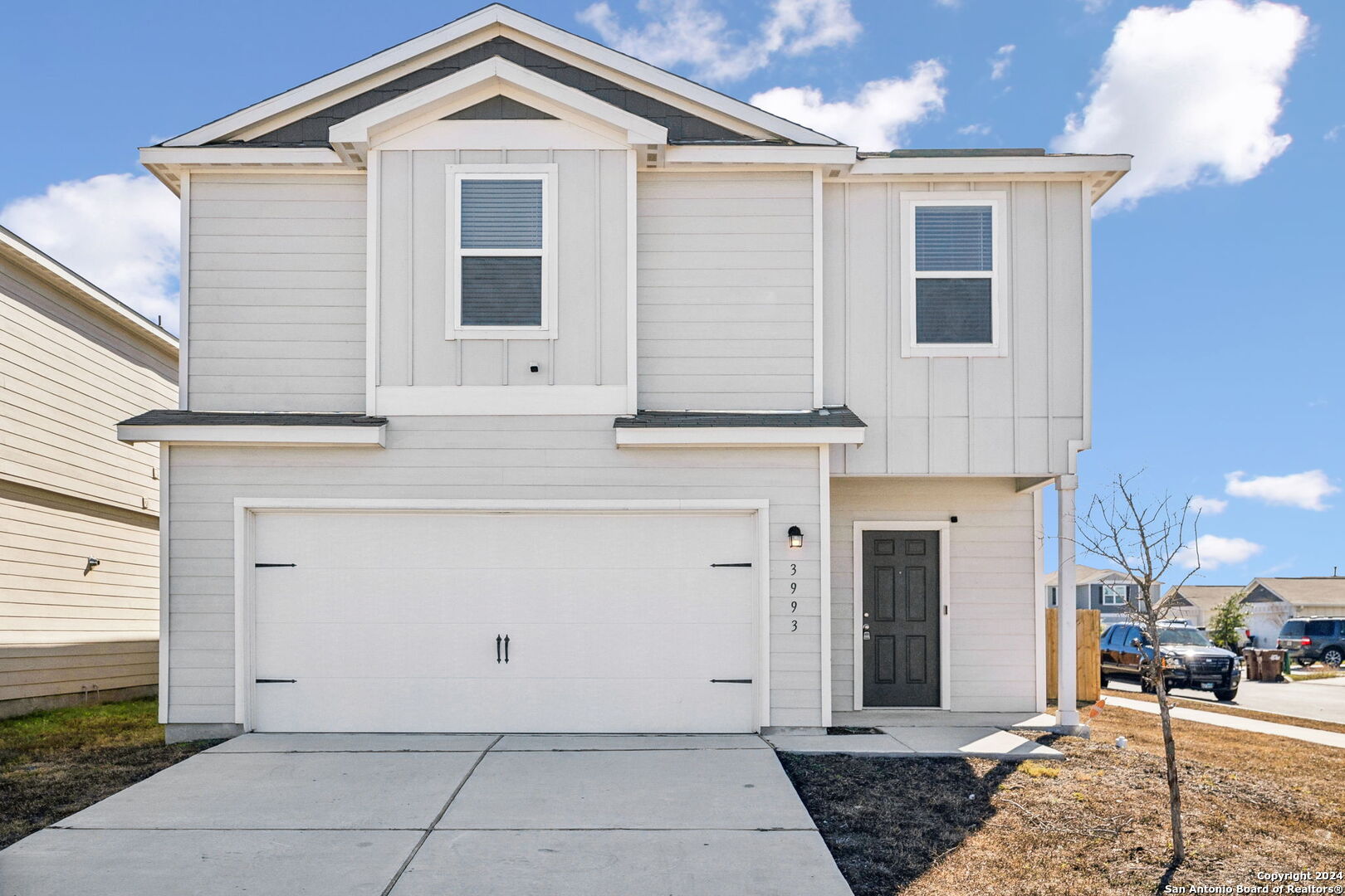 a front view of a house with a garage