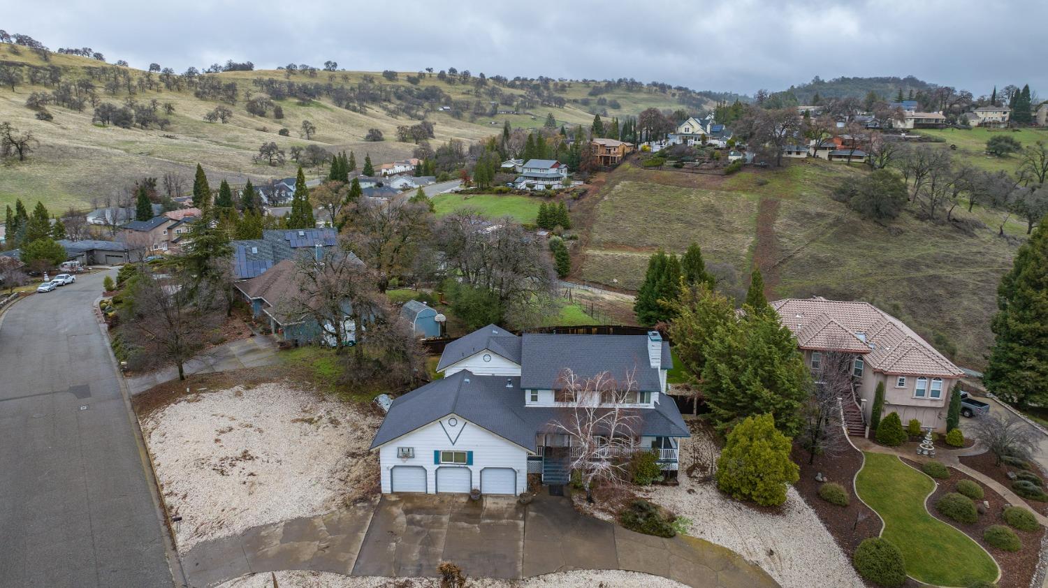 an aerial view of a house with a lake view