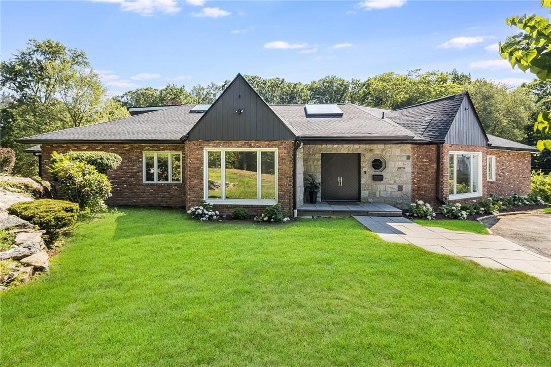 front view of a house with a yard