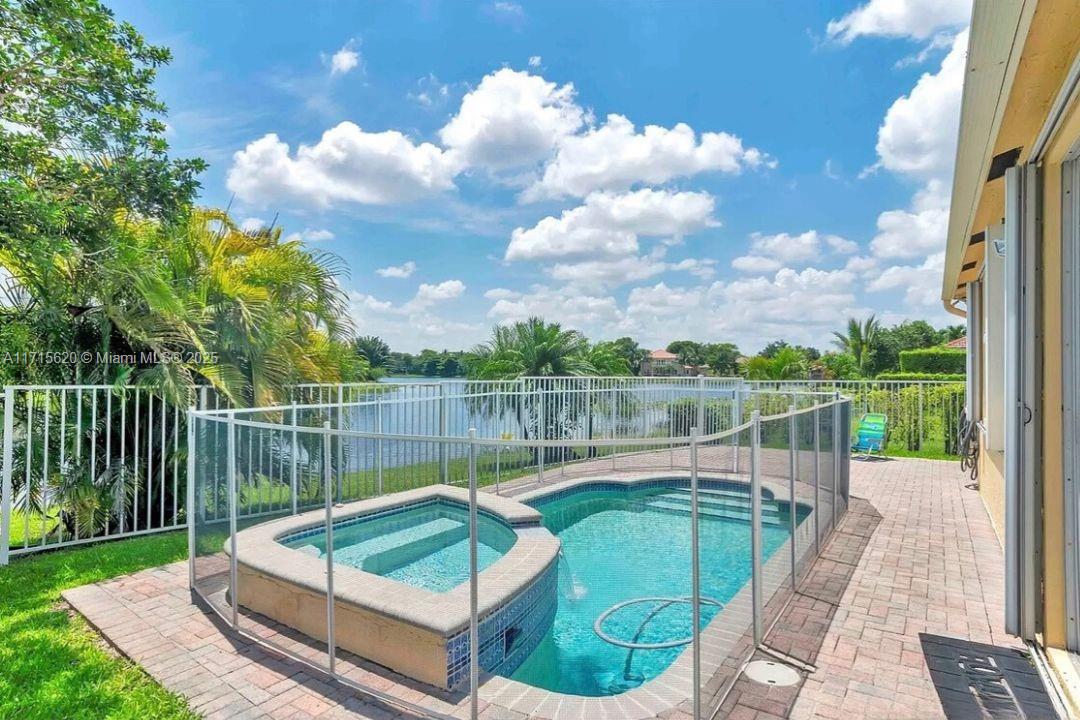 a view of a swimming pool with a patio