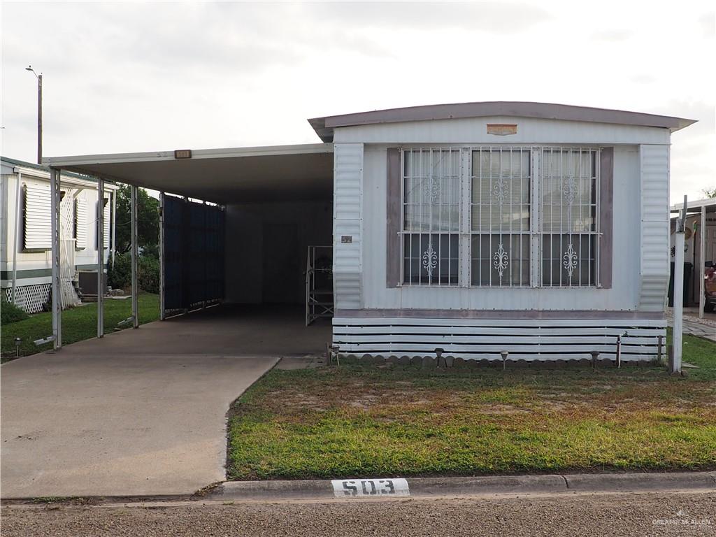 Front of Mobile home with carport