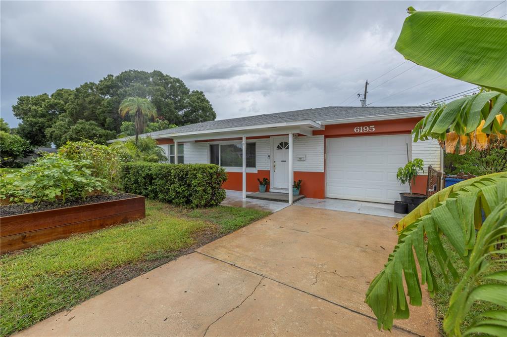 a view of house with outdoor space and entertaining space