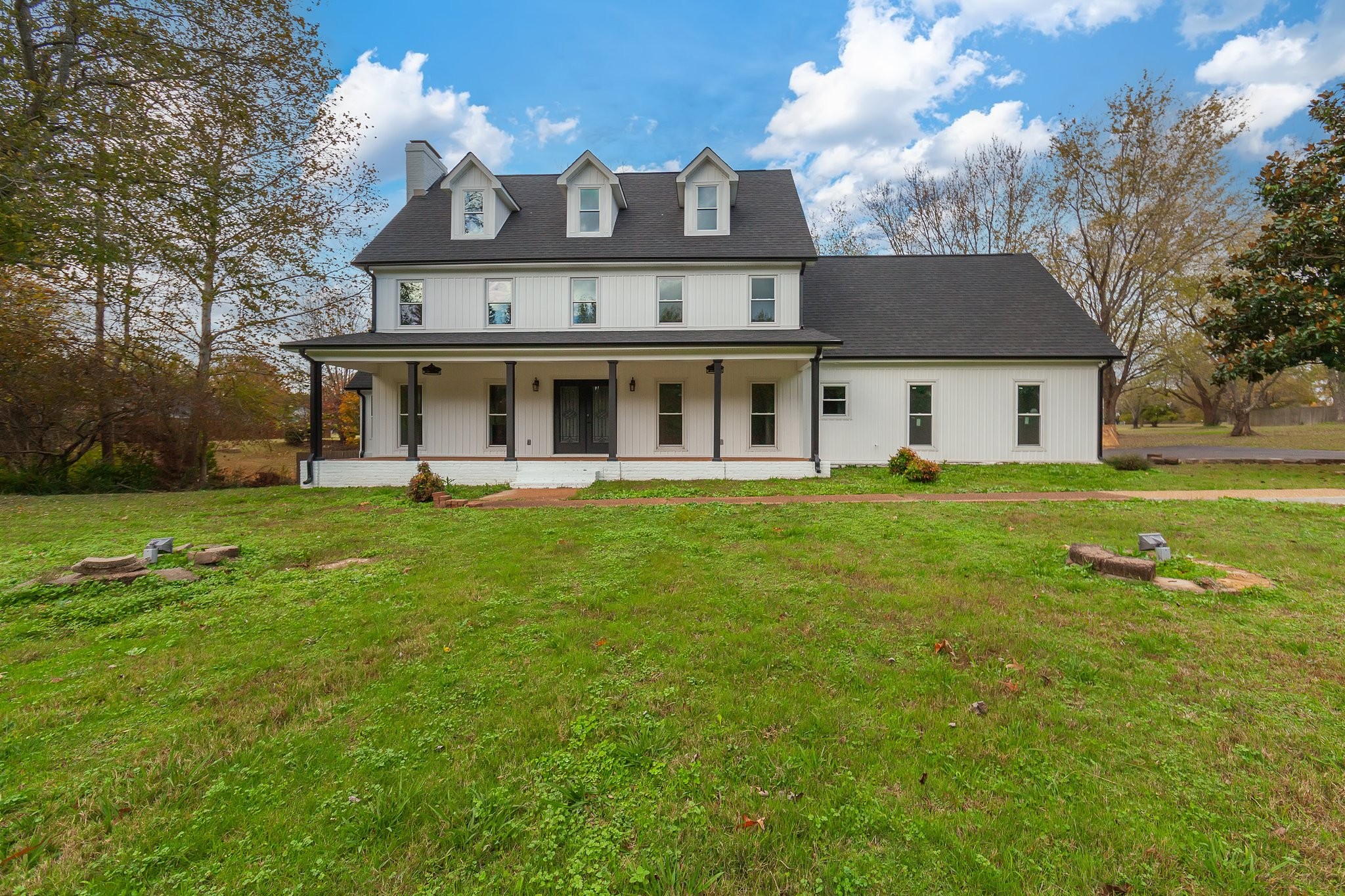 a front view of a house with garden