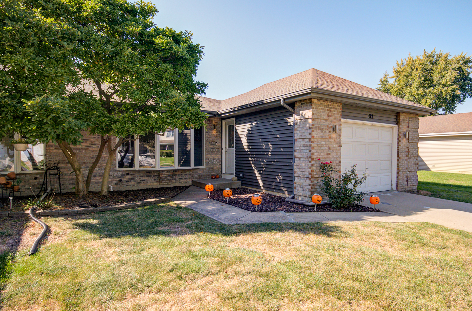 a front view of a house with a yard