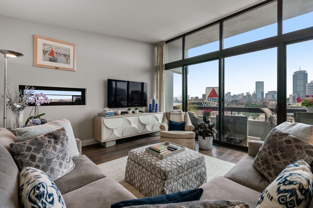 a living room with furniture and a flat screen tv