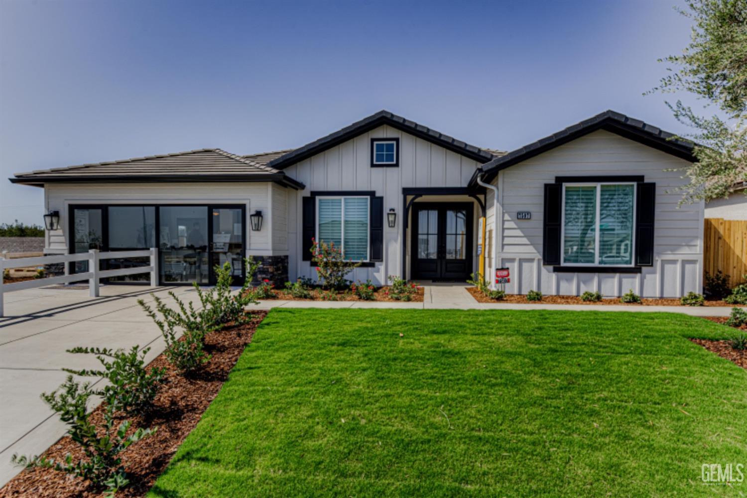 a front view of house with yard and outdoor seating