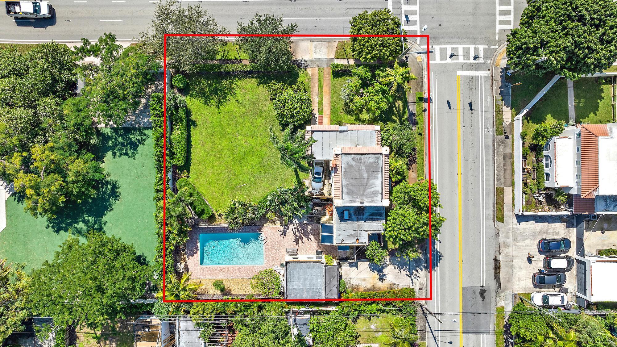 an aerial view of a house with a yard and garden