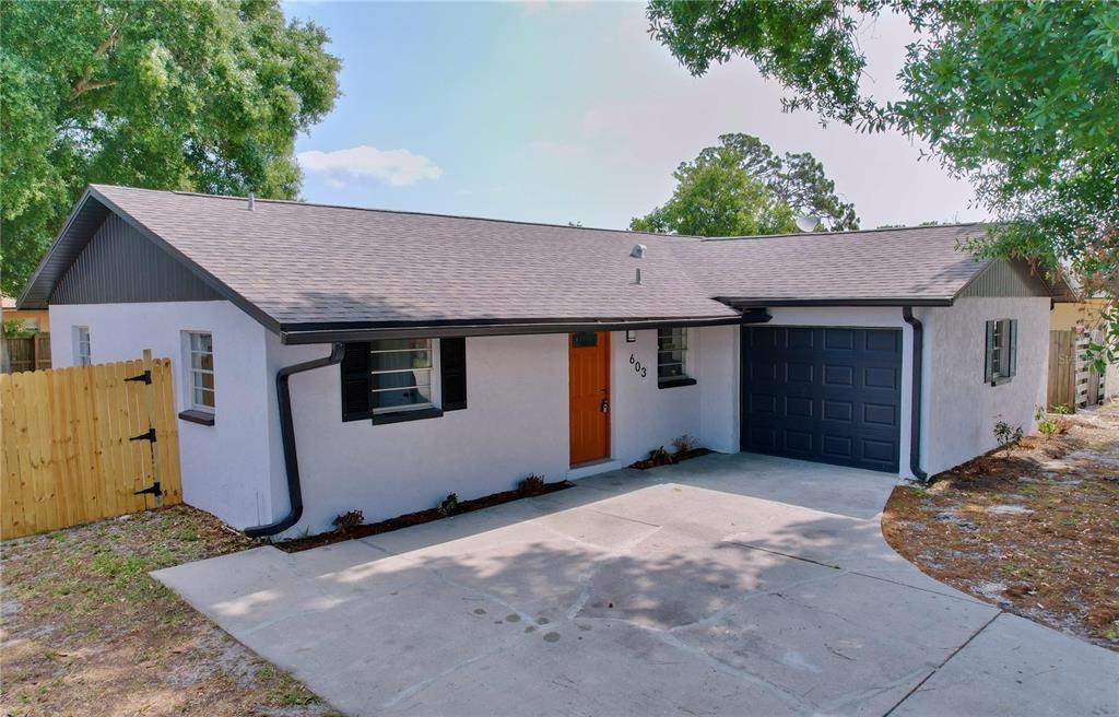 a front view of a house with a garage