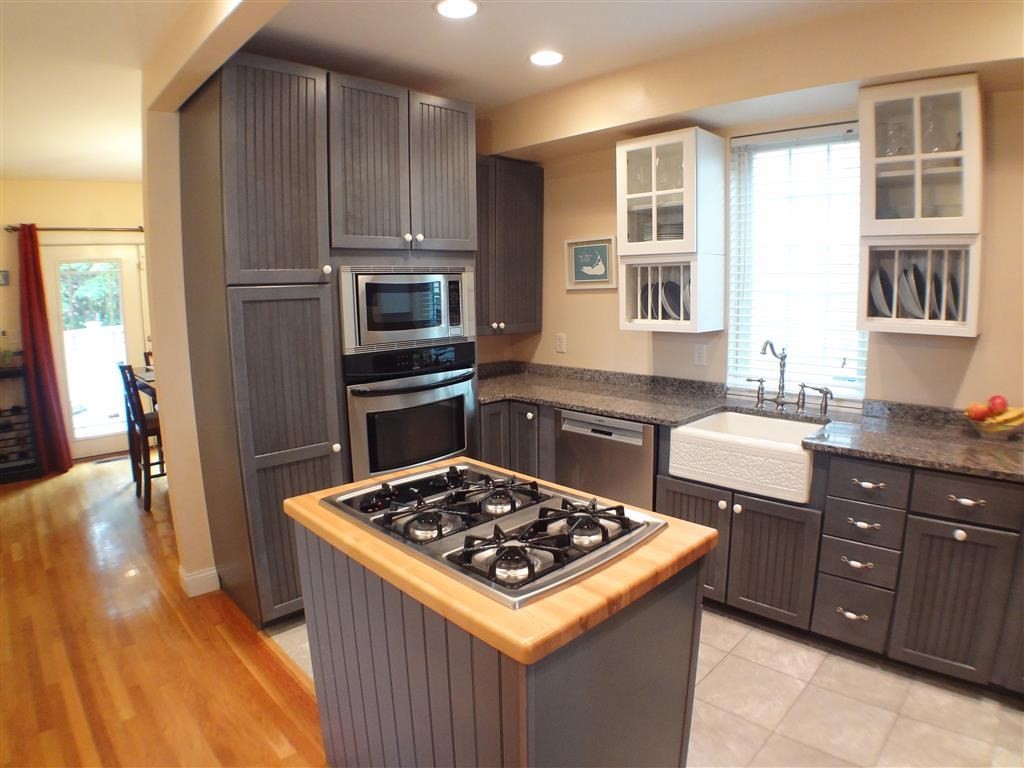 a kitchen with a stove and a sink