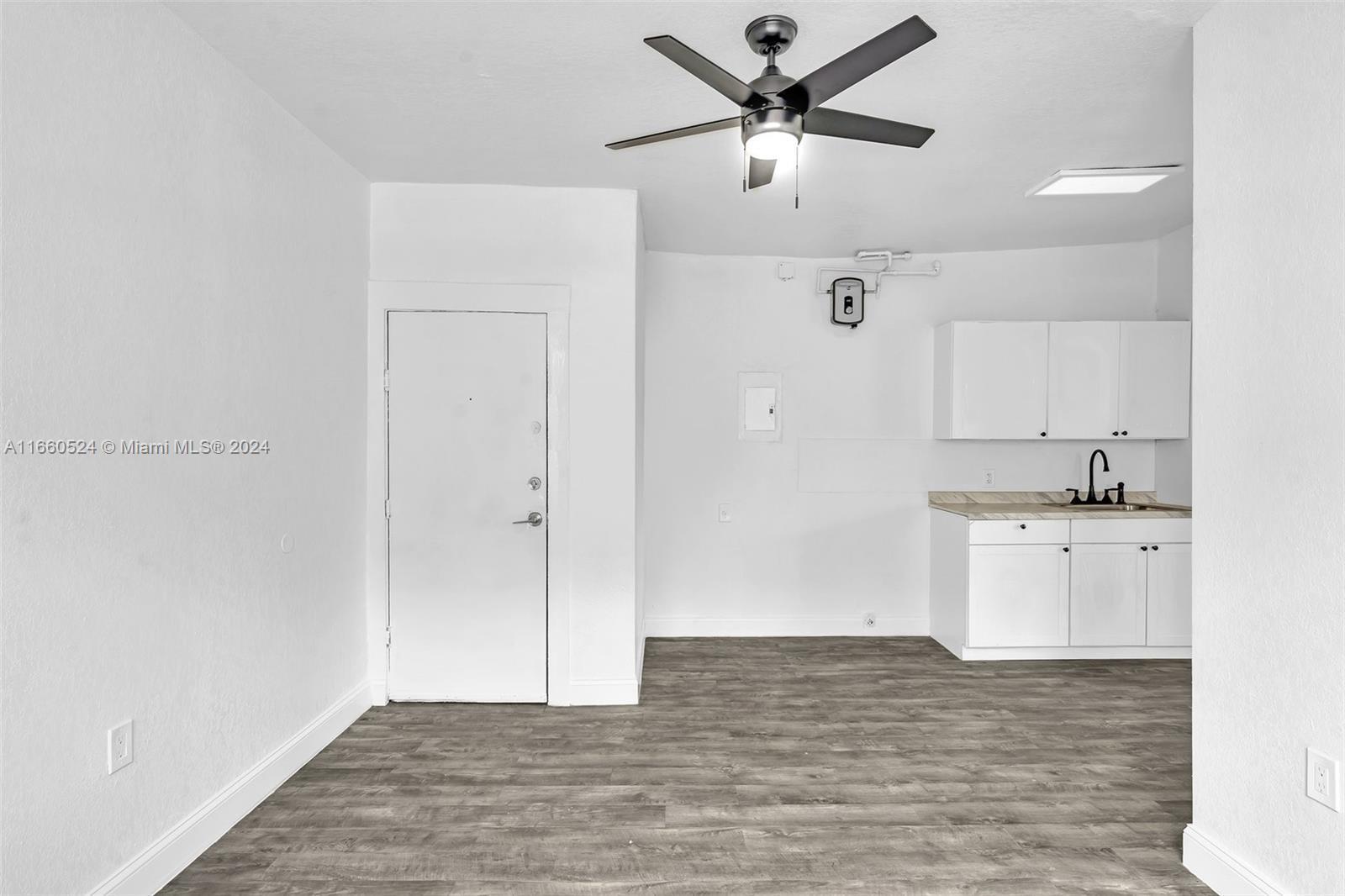 a view of a kitchen with a sink dishwasher and a refrigerator