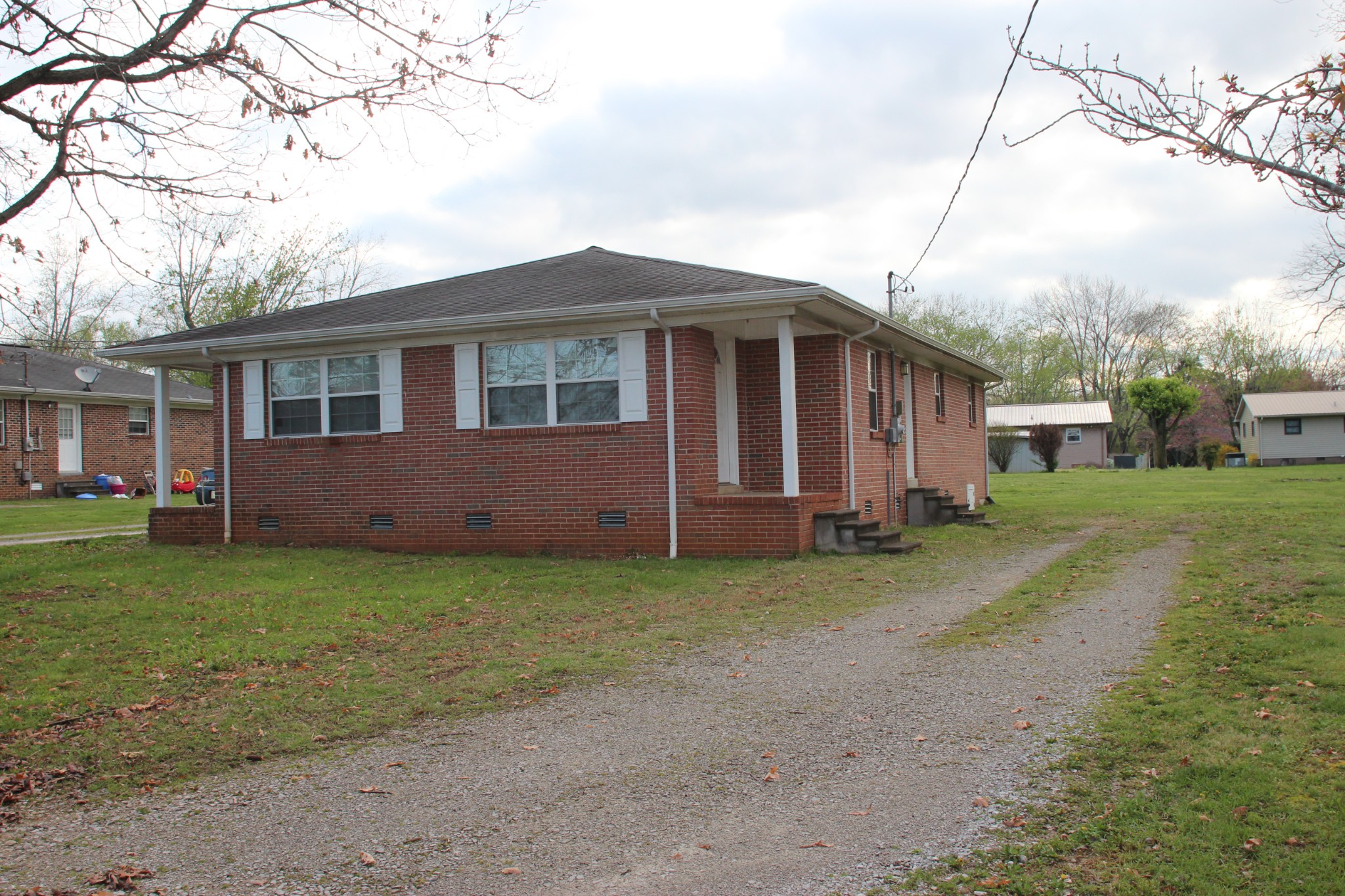 a view of a house with a yard