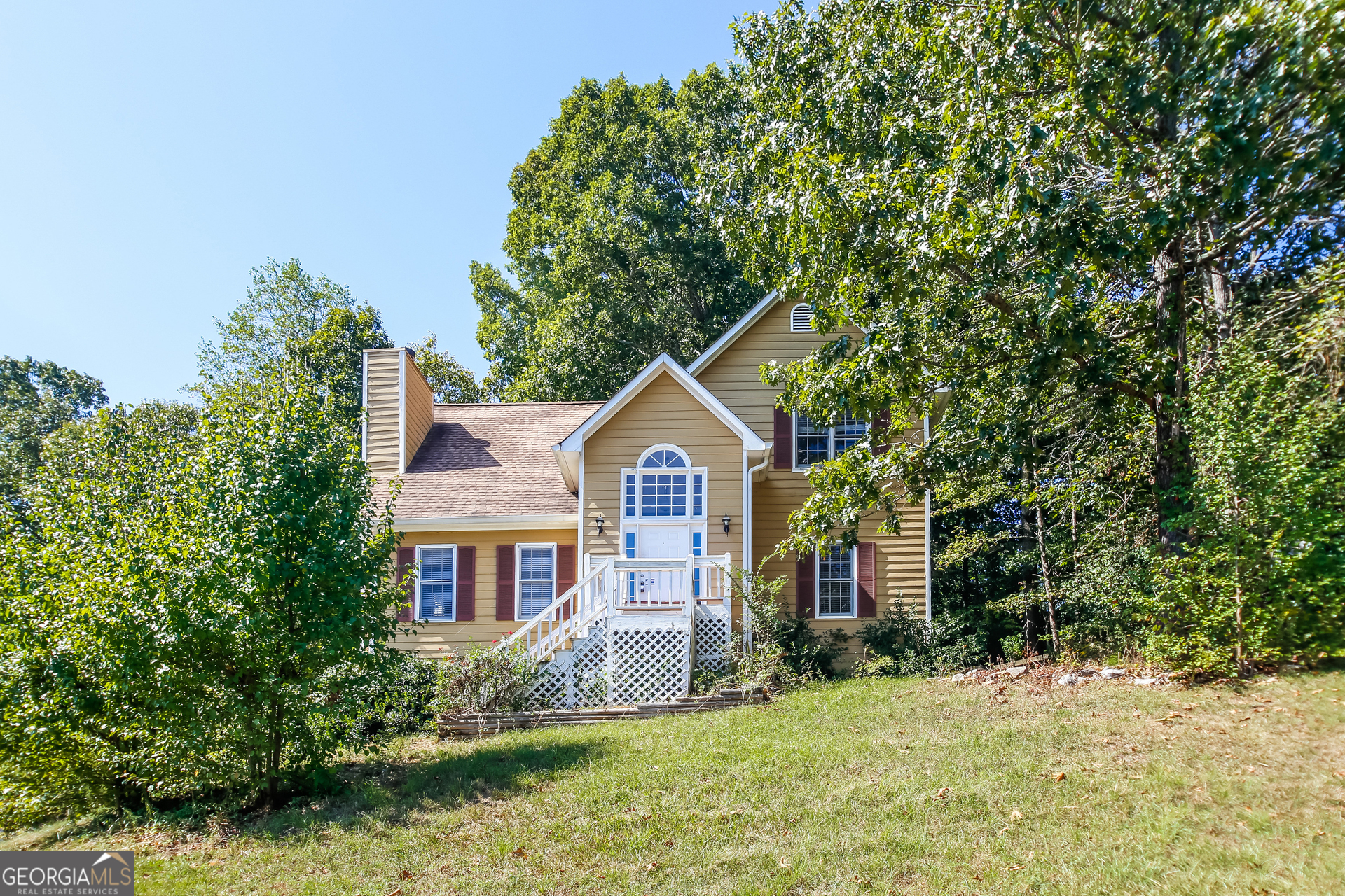 a front view of a house with a yard